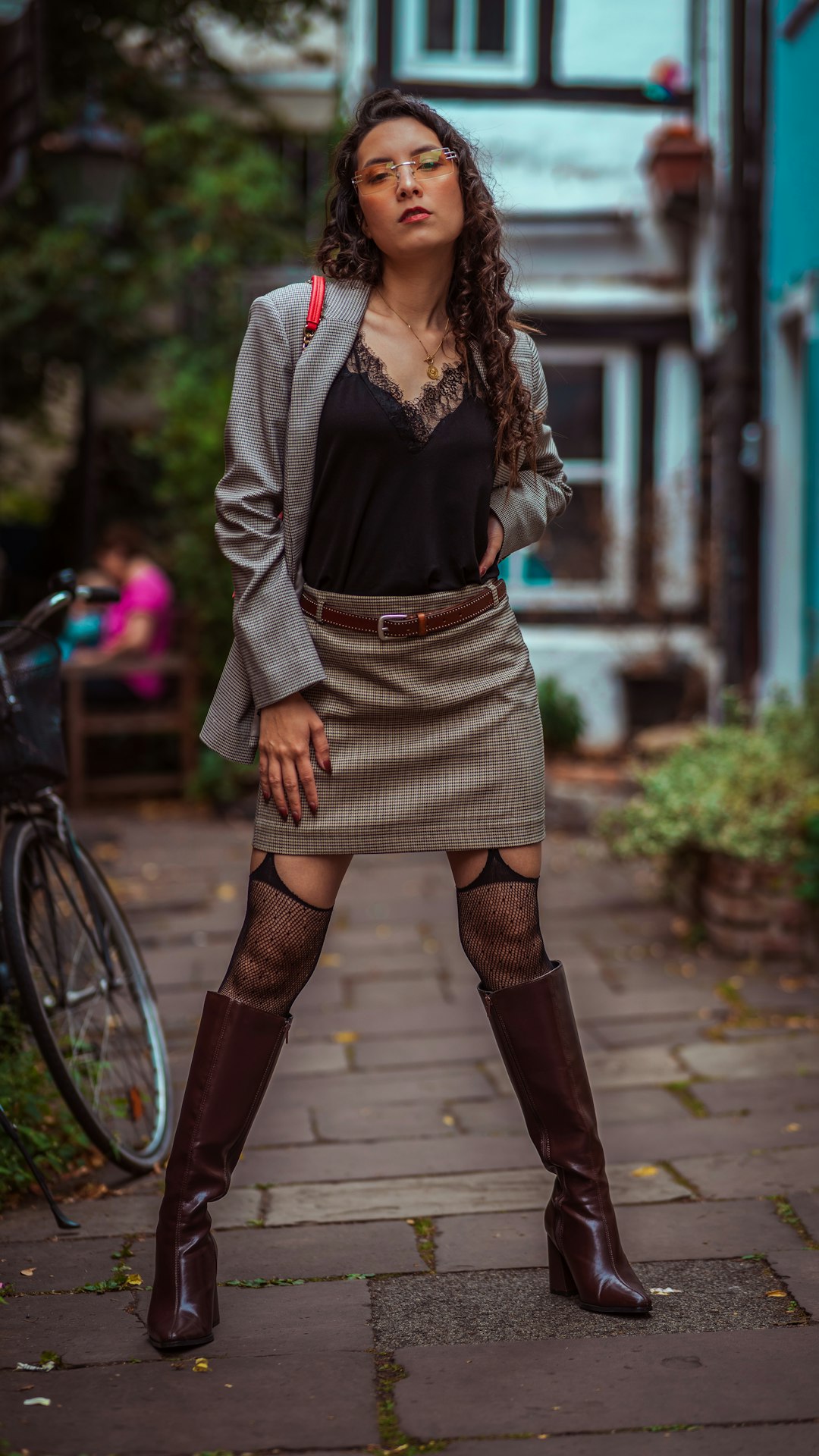 Woman in a plaid blazer and skirt