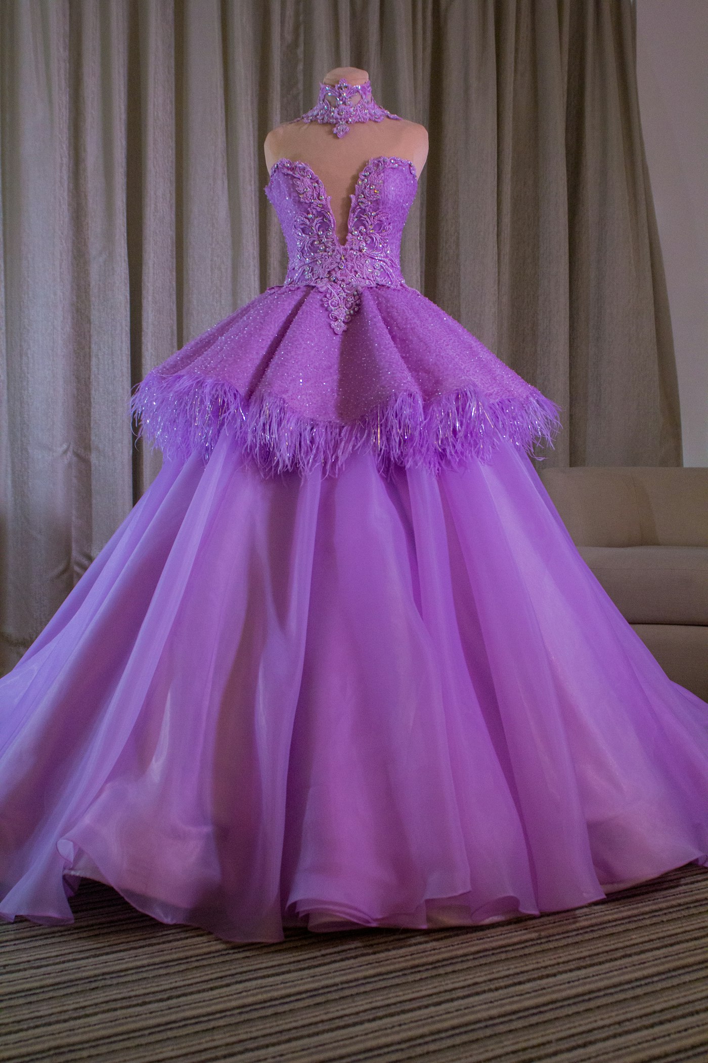 A purple dress laid out on a table