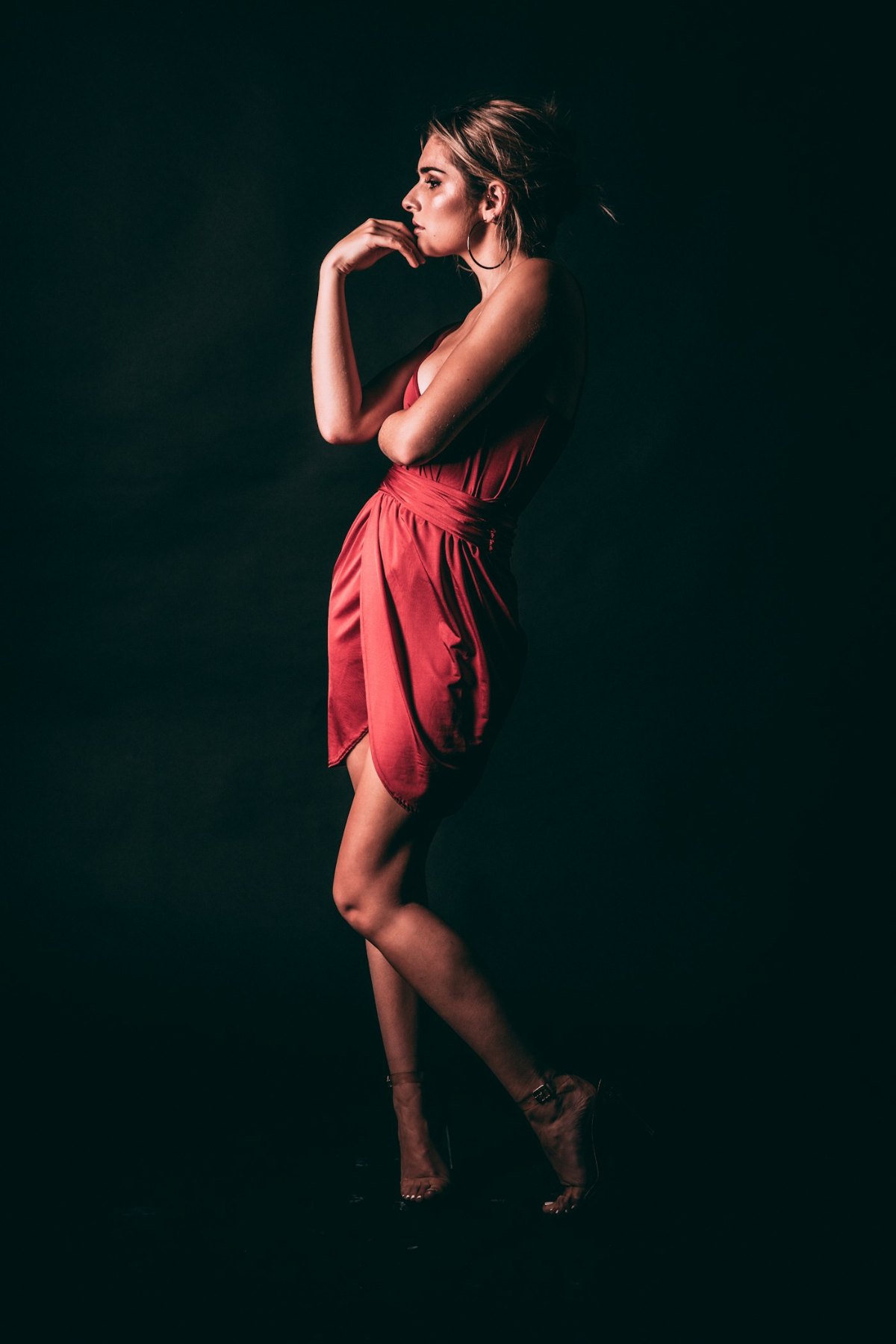 Woman in a red dress posing for a portrait