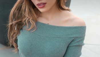 Soft green knit sweater outfit inspired by the crochet headscarf trend