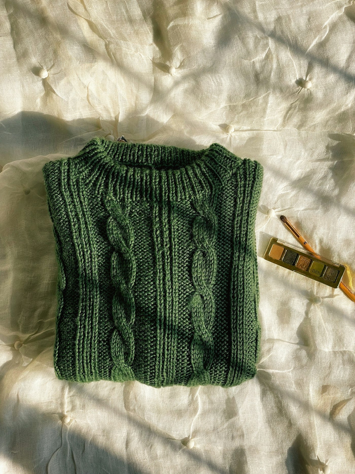 Soft green knitted garment close up