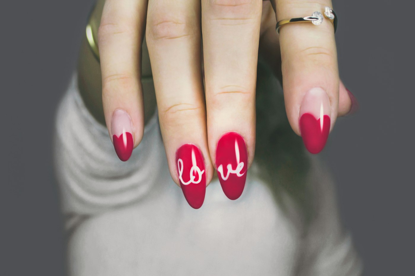 Selective focus of a woman's soft pink manicure