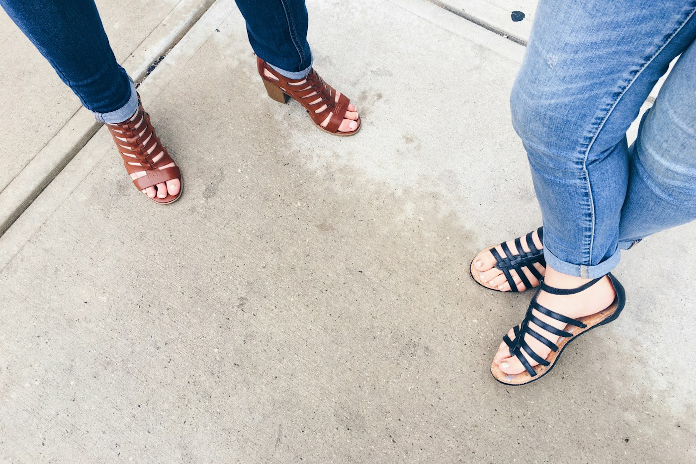 Strappy leather sandals worn on the grass