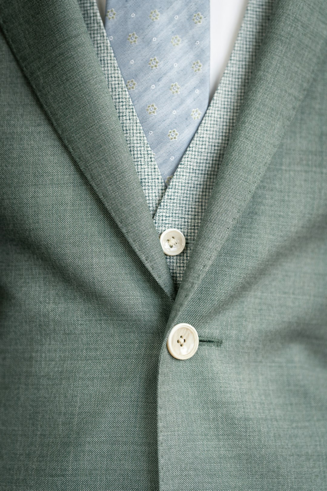 Tailored suit jacket with a button-up shirt showing clean structured lines