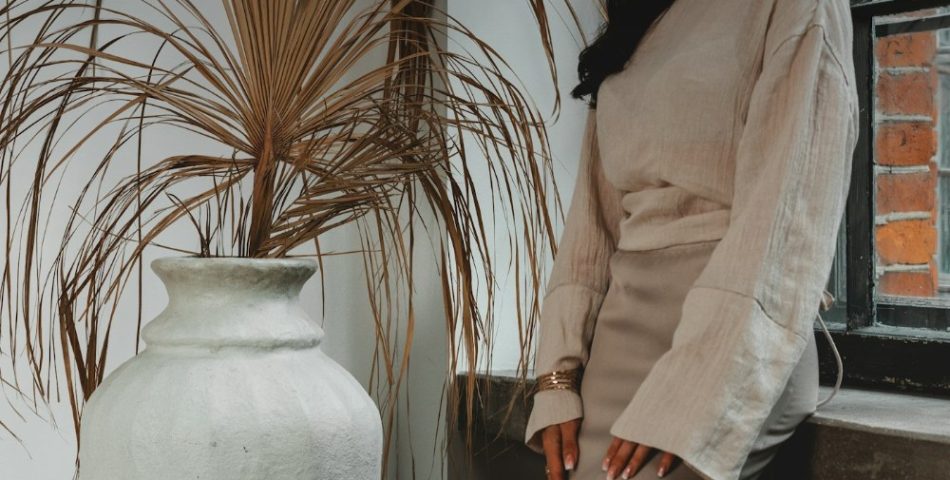 Woman in a tonal neutral outfit styled in cream and beige tones
