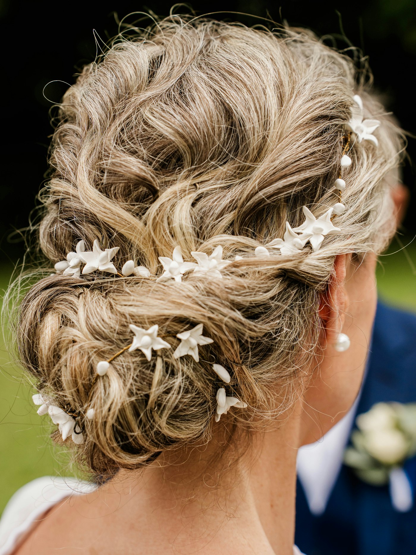 Elegant updo with star and pearl hair accessories