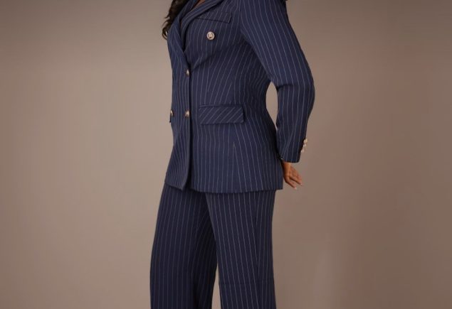 Woman in a navy pinstripe suit as inspiration for wearing vintage tailoring