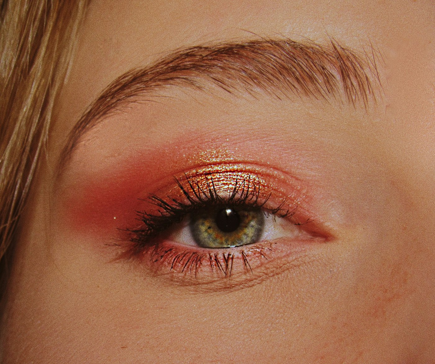 Woman wearing pink and gold eyeshadow