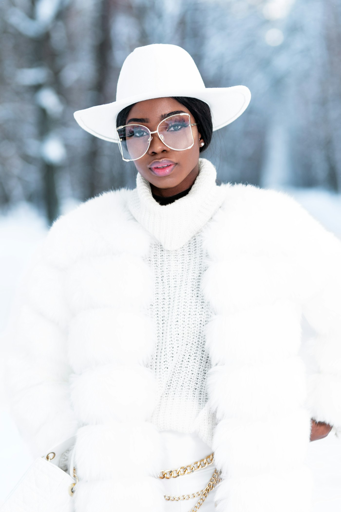 Woman in a white fur coat and black glasses