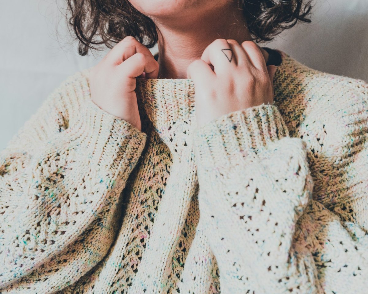 Woman in a white knit sweater