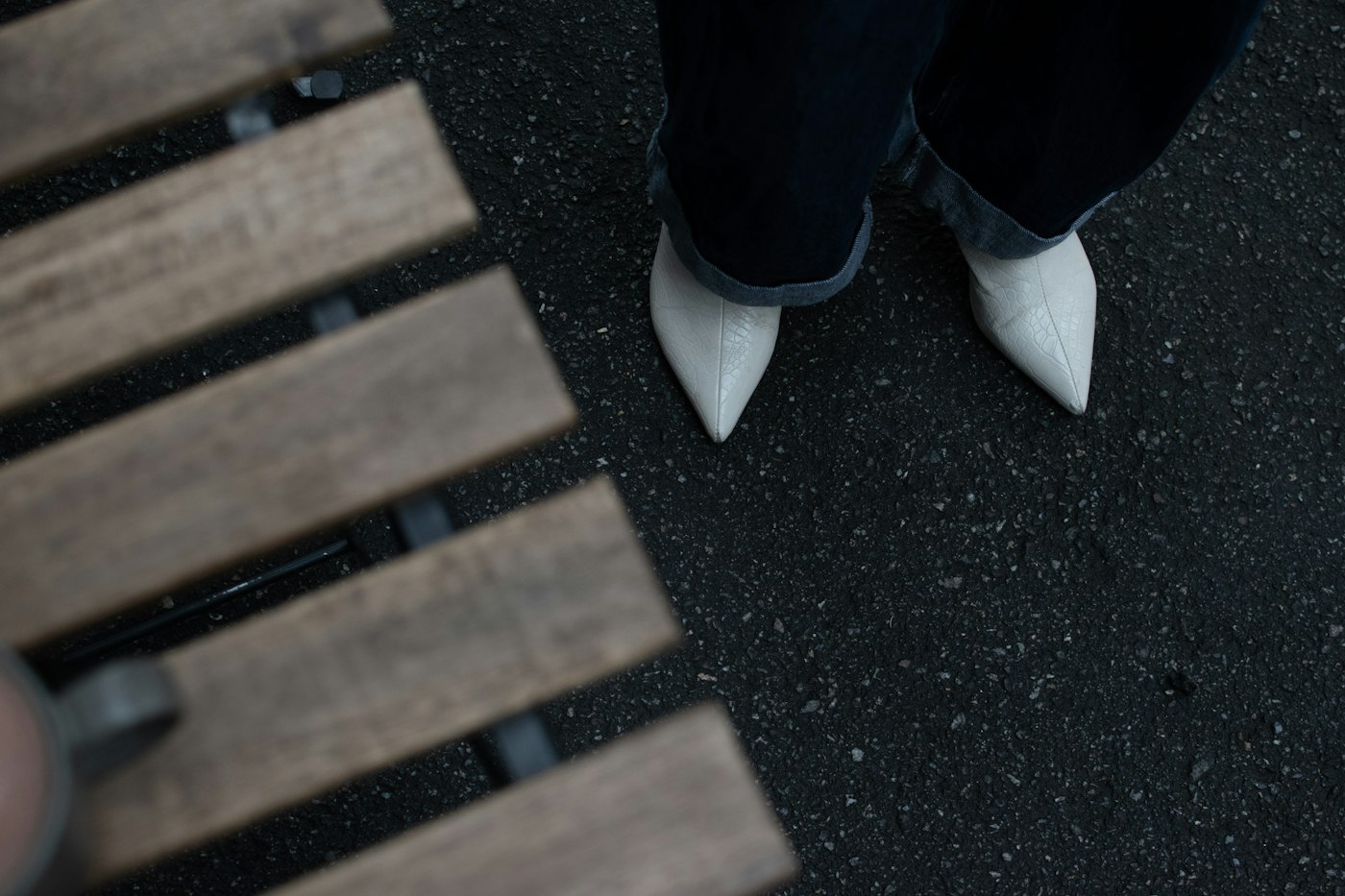 White shoes beside a wooden bench, a pale shoe option for a white outfit