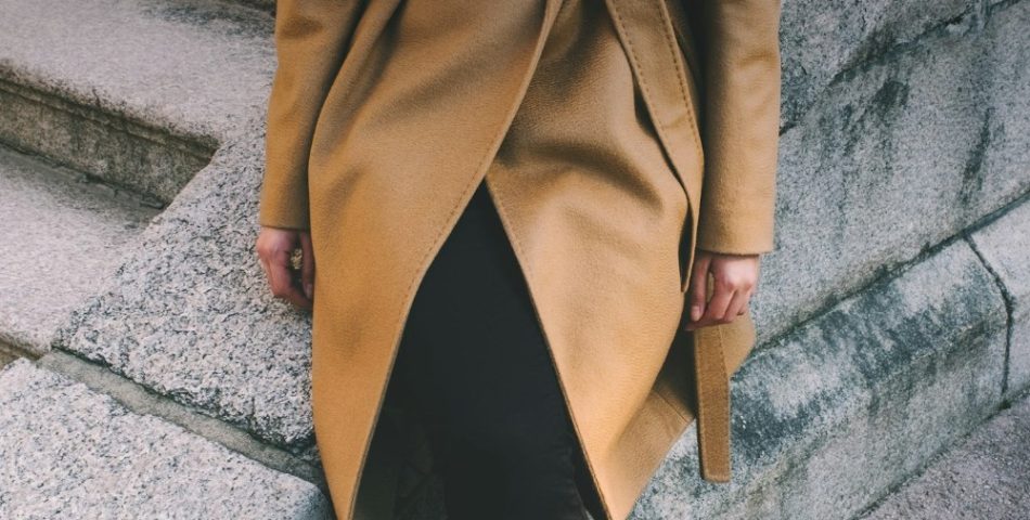 Woman in a brown notched lapel coat styled for a winter workday