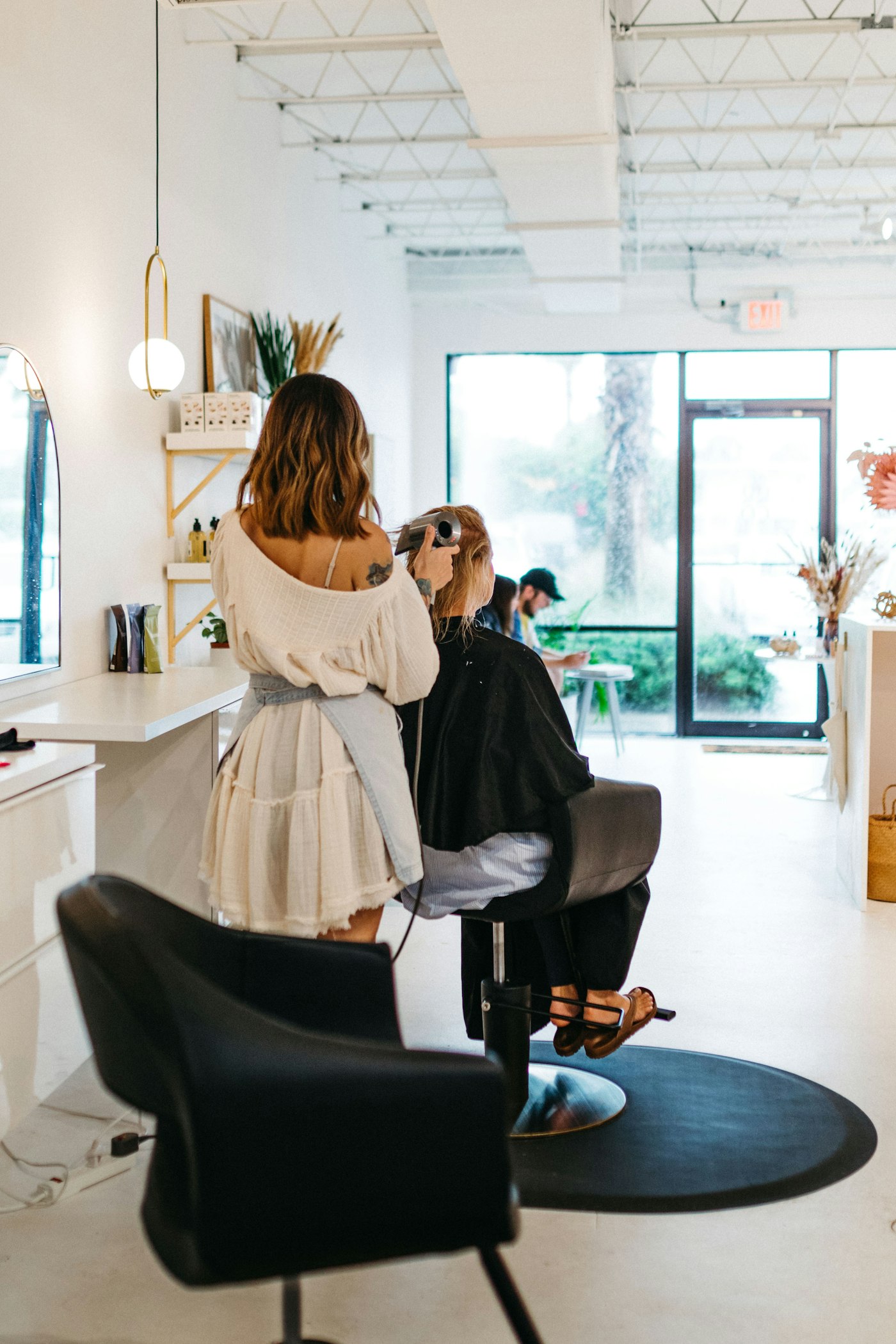 Woman getting her hair done in a salon